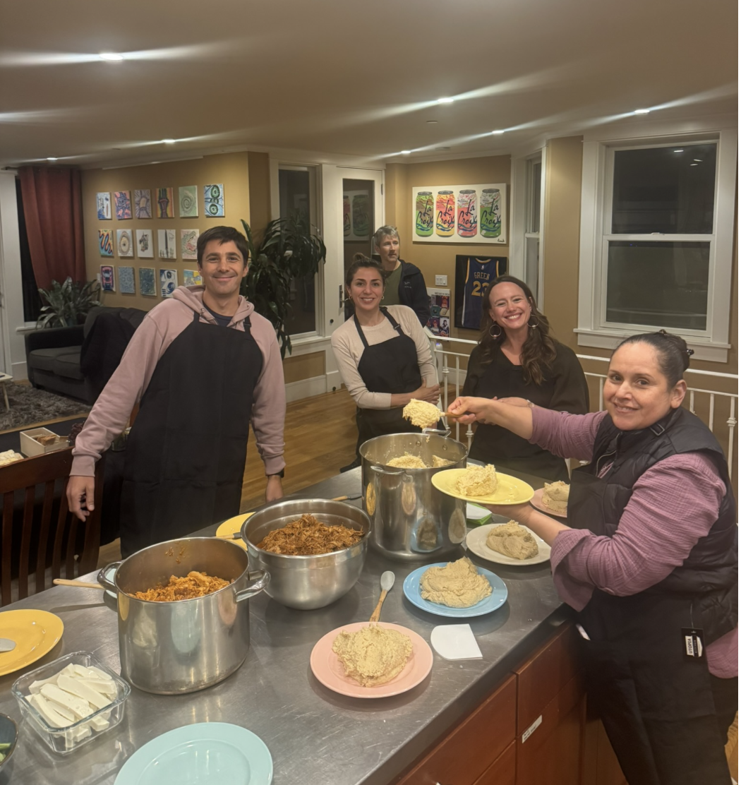 Families preparing food together at a Count Me In event