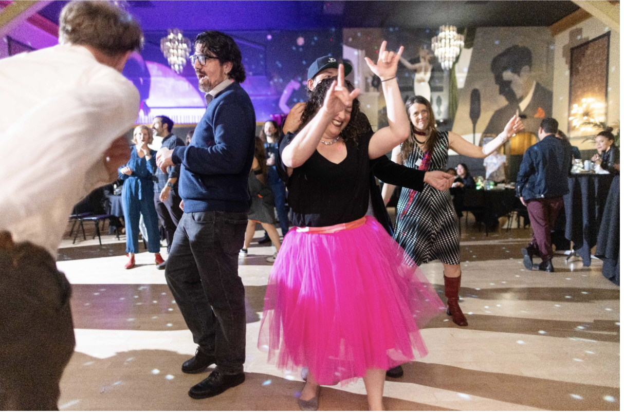 Adults dancing at Una Noche